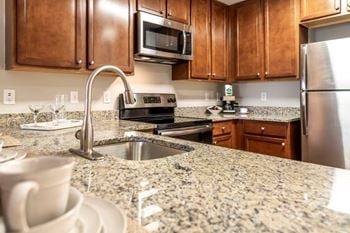 Nobe market apartments in north bethesda, maryland model kitchen with gooseneck faucet and undermount sinks